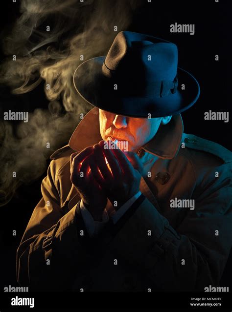 Private Detective Lighting A Cigarette Film Noir Style Stock Photo Alamy