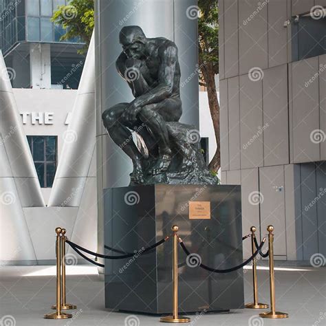 A Bronze Sculpture Of The Thinker Editorial Photography Image Of Tree