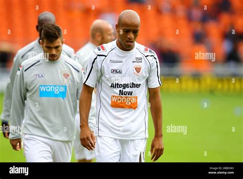 Blackpools Filipe Tiago Gomes Left And Alex Baptiste Warm Up Stock