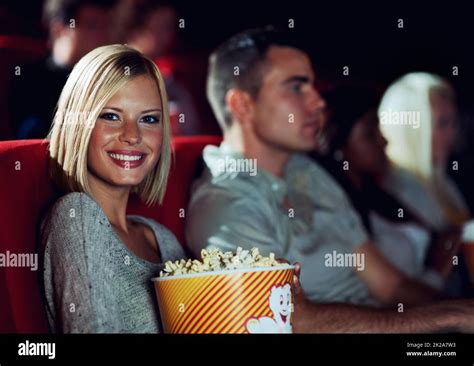 Me And My Popcorn A Young Girl Eating Popcorn While Watching A Movie