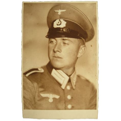 Wehrmacht Unteroffizier in dress uniform and peaked cap