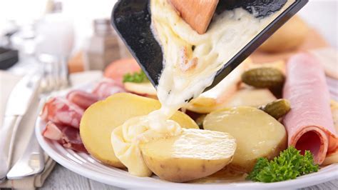 Cheese Fondue Vs. Raclette: What's The Difference?