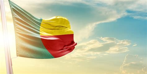 Premium Photo Benin National Flag Waving In Beautiful Sky