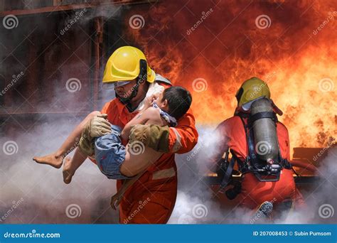 Firefighter Holding Child Boy To Save Him In Fire And Smoke Firemen