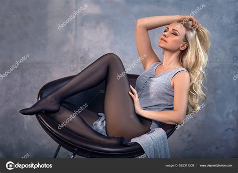 Beautiful Blonde Girl Perfect Legs Pantyhose Posing Barefoot Chair