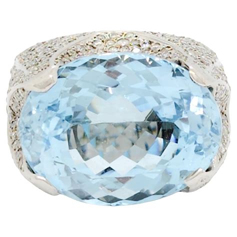 Customizable 7 25 Ct Oval Blue Topaz And Diamond Cocktail Ring In 18K