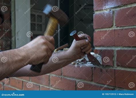 Workman Using A Hammer And Chisel To Remove Old Mortar Stock Image