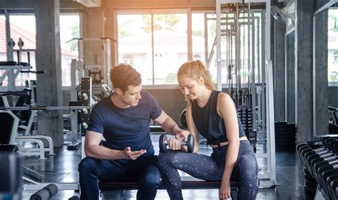 Premium Photo Fitness Man And Woman Giving Each Other A High Five