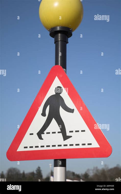 Pedestrian crossing sign red triangle yellow beacon Stock Photo - Alamy