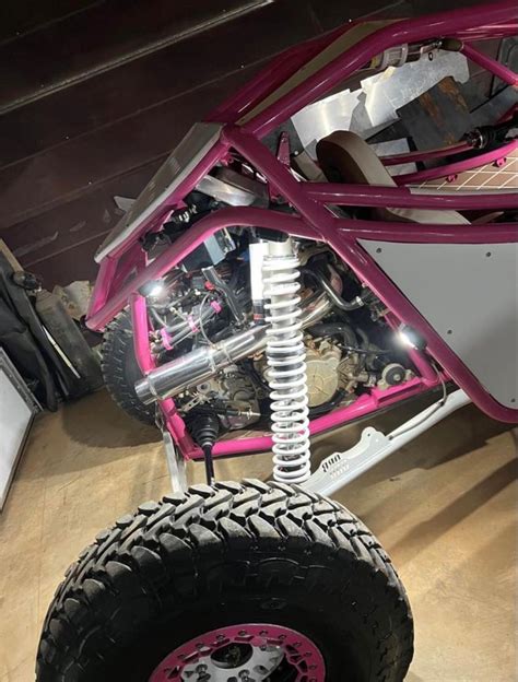 Pink and White ATV with Rock Lights for Off-Road Adventures