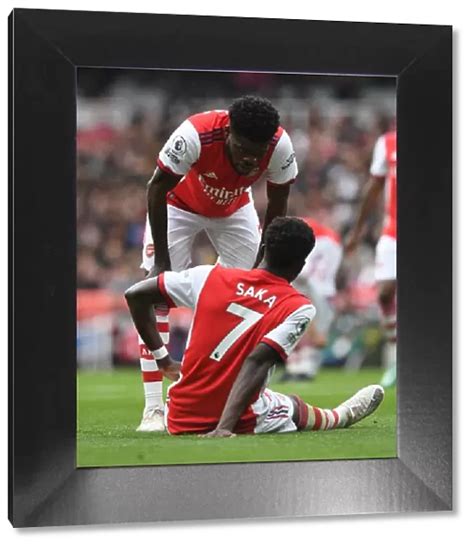 Framed Print Of Thomas Partey And Bukayo Saka In Action