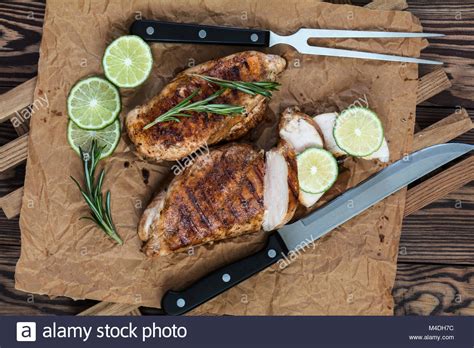 Grilled Chicken Filet With Herbs On A Paper Stock Photo Alamy