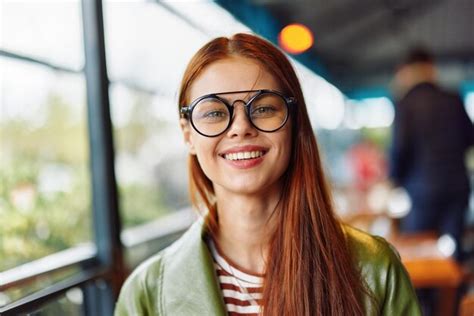 Premium Photo Portrait Of Young Woman Wearing Sunglasses