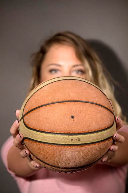 Premium Photo Portrait Of A Young Woman Holding Ball