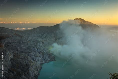 Stunning sunrise or sunset on Ijen Crater. Ijen Crater is a volcanic ...