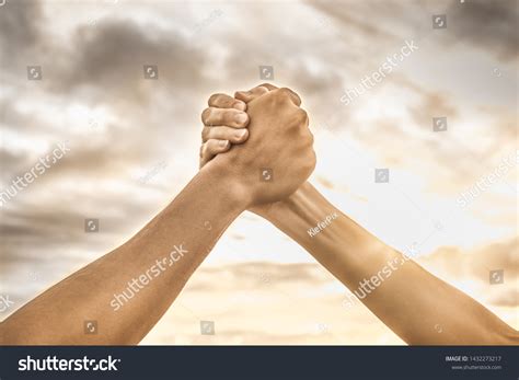 Strong Hands Coming Together Grasping One Stock Photo Edit Now 1432273217