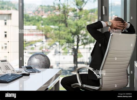 Portrait Of A Young Business Man Using A Computer In The Office Stock Photo - Alamy