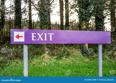 Exit Sign in Parking Lot with Arrow Pointing Direction Stock Photo ...