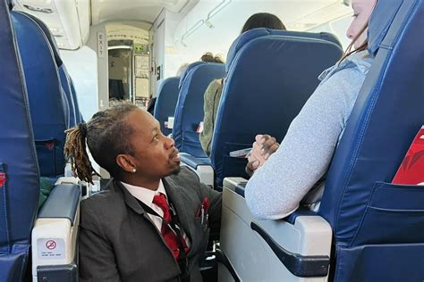 Flight Attendant Sits On The Floor To Comfort Passenger Upworthy