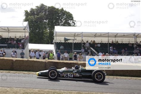 Sir Jackie Stewart GBR Demonstrates The 1965 Lotus Ford 38 IndyCar