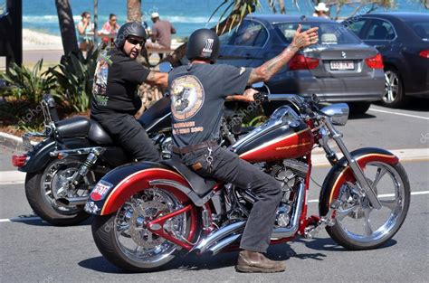 Men ride Harley-Davidson motorcycle in city street – Stock Editorial ...