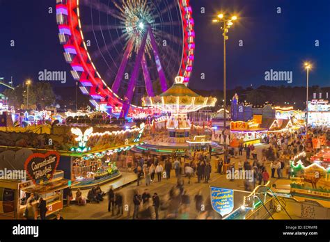 Fairground rides at the cannstatter volksfest in stuttgart hi-res stock ...