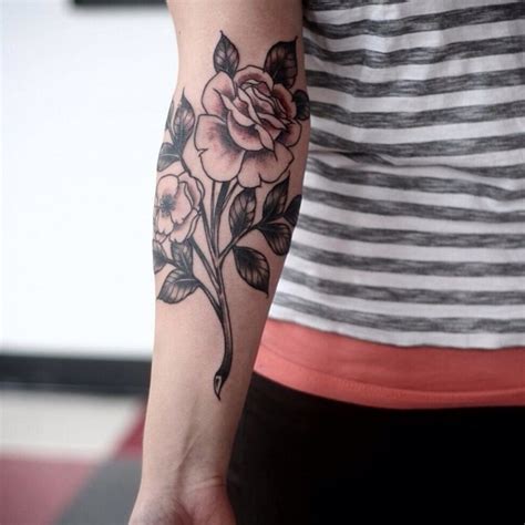 Great Black Ink Vintage Rose Flower On Stem Tattoo On Arm