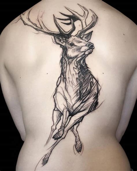 Sketch work deer tattoo on the back.