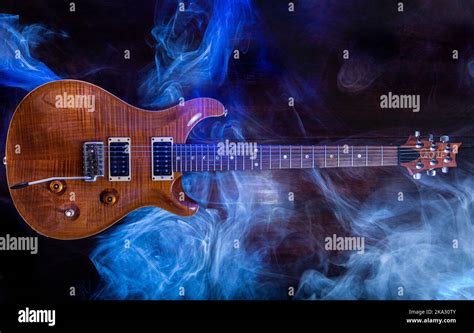 A Top View Of Paul Reed Smith Guitar In The Studio With Blue Smoke In