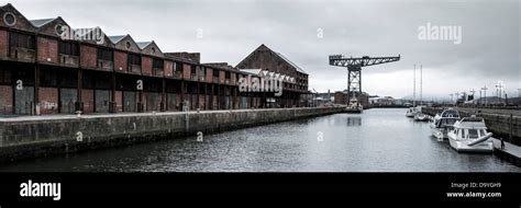 Victorian Industrial Dock Containing Warehouses And Leisure Craft And A