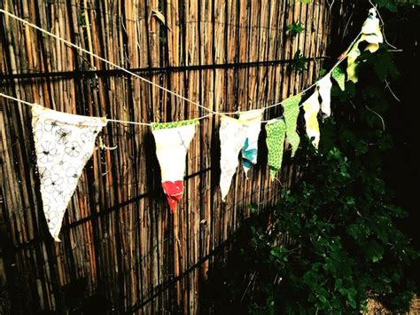 Premium Photo Bunting Flags Hanging Against Wooden Fence