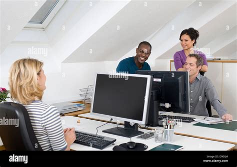 People working together in office Stock Photo - Alamy