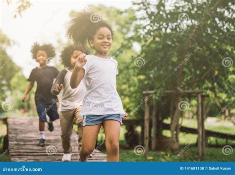 Kids playing outdoors stock photo. Image of caucasian - 141681108