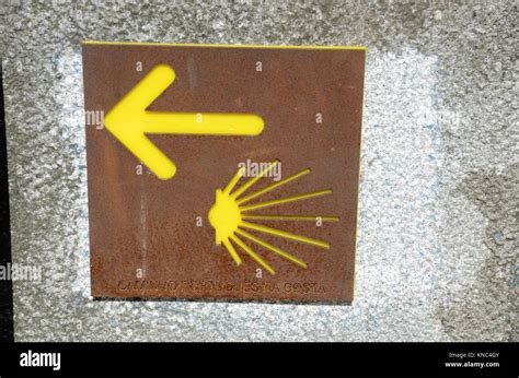 A Plaque On A Wall In Porto Showing The Yellow Arrow Indicating The