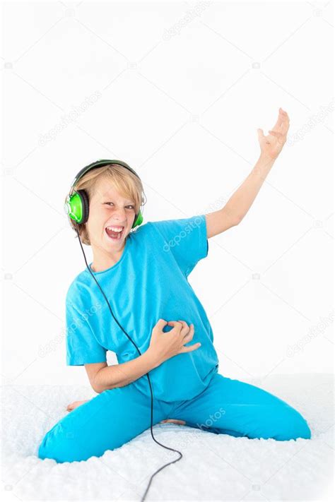 Young Teen Kid Playing Air Guitar — Stock Photo © Mandygodbehear 6361986