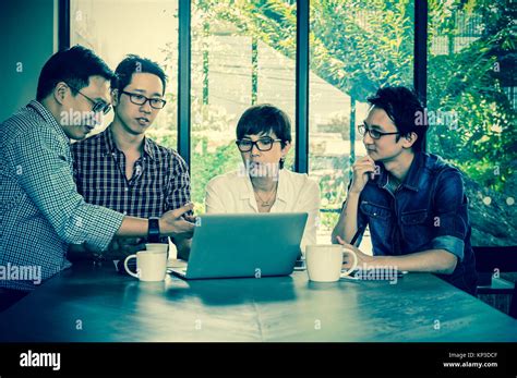 Group Of Asian Business People With Casual Suit Are Meeting In The