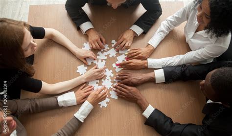 Diverse Team People Assembling Jigsaw Puzzle Multiracial Group Of