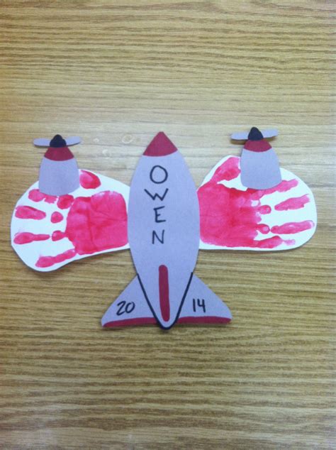 Airplane Design With Their Handprints And Cut Out Pieces Of