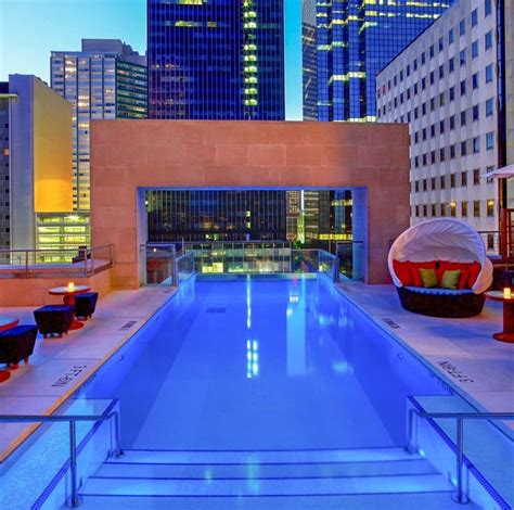 Glass-fronted rooftop pool in Dallas at night | Hotel pool, Dream pools ...