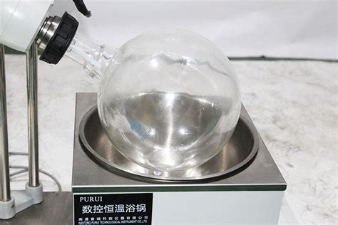 Thin Film Rotary Vacuum Evaporator Device With Heating Bath