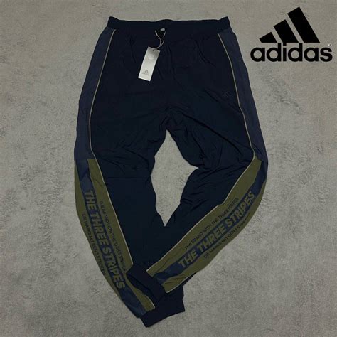 未使用送料360円 Mサイズ 新品 adidas ウーブンパンツ スリーストライプス ナイロン THE THREE STRIPES