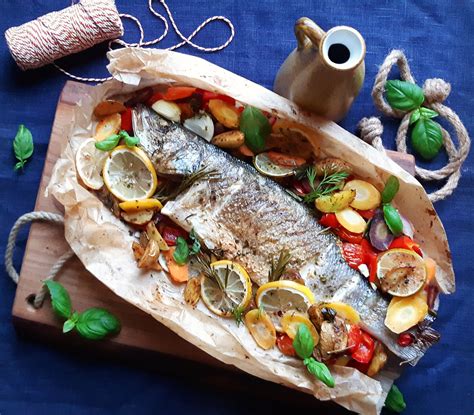 Oven Roasted Sea Bass With Potatoes Vegetables And Herbs Website