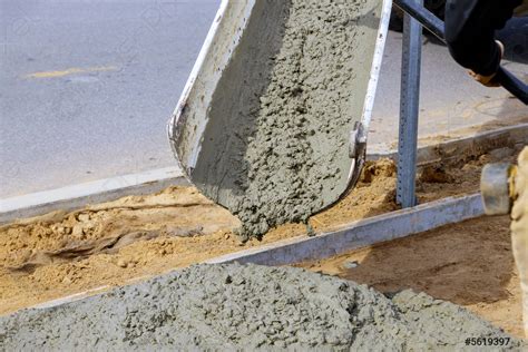 Concrete truck with pouring cement during to residential street - stock ...