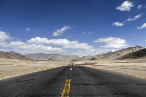 Take A Low Angle Photograph Of A Newly Built Straight Asphalt Road