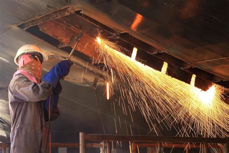 A Welder Working A Torch At Shipyard 10381791 Stock Photo At Vecteezy