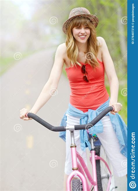 Spending A Day In The Country A Young Woman Riding Her Bicycle Outside