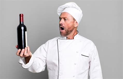 Premium Photo Middle Age Man Chef Concept And A Wine Bottle Sport