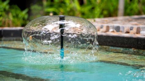 Premium Photo | Shot of a fountain in the green garden park