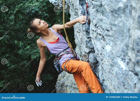 Young Slim Woman Rock Climber Climbing on the Cliff Stock Photo - Image ...