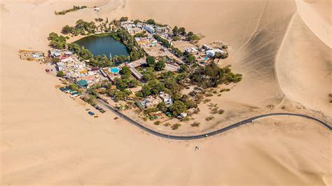 Download Peru Huacachina Oasis Aerial Wallpaper | Wallpapers.com